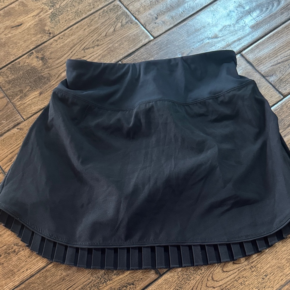 Pleated Women's athletic/tennis skirt. Only worn once, biker shorts underneath.